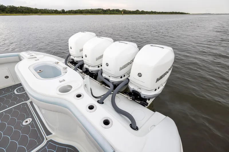 Slide: The Image of 2018 Yellowfin 39 Offshore boat with four Mercury outboard engines on calm water. - 33