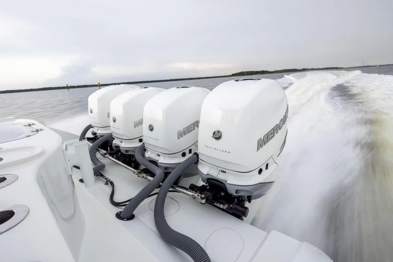 Slide: The Image of 2018 Yellowfin 39 Offshore boat with four powerful Mercury outboard engines on open water. - 36
