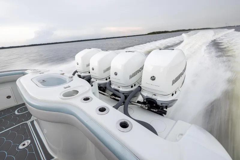Slide: The Image of 2018 Yellowfin 39 Offshore boat with powerful Mercury outboard engines on open water. - 37