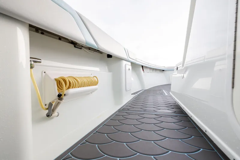 Slide: The Image of 2018 Yellowfin 39 Offshore boat deck with coiled hose and non-slip flooring. - 40
