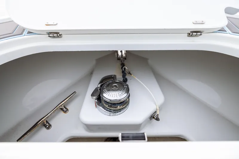 Slide: The Image of Anchor compartment of 2018 Yellowfin 39 Offshore boat, featuring a winch and cleat. - 44