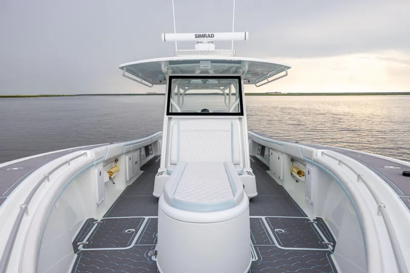 Slide: The Image of 2018 Yellowfin 39 Offshore boat interior with seating, on calm water. - 47