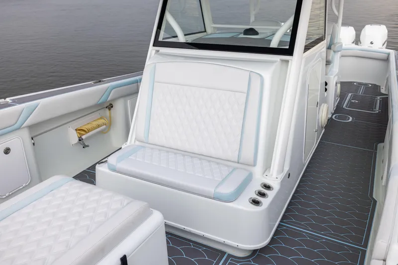 Slide: The Image of 2018 Yellowfin 39 Offshore boat interior with white seating and modern design. - 48
