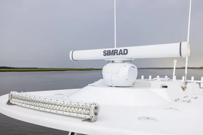 Slide: The Image of 2018 Yellowfin 39 Offshore boat with Simrad radar system on calm water. - 49