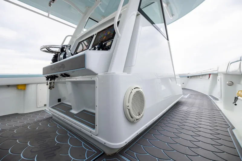 Slide: The Image of 2018 Yellowfin 39 Offshore boat interior with modern helm and sleek design. - 56