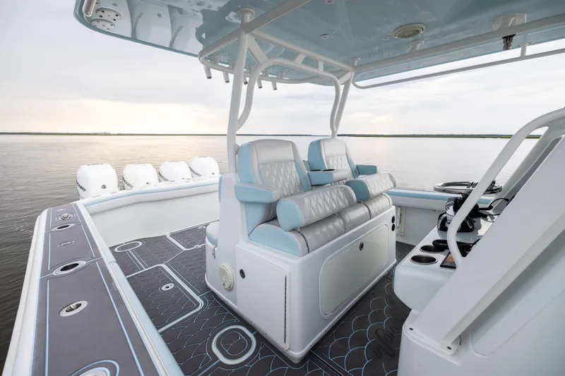 Slide: The Image of 2018 Yellowfin 39 Offshore boat interior with luxurious seating and modern design on calm water. - 64
