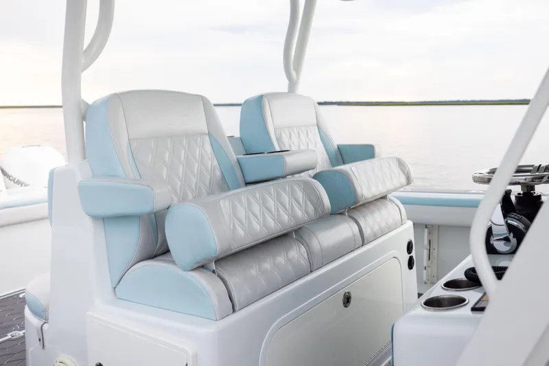 Slide: The Image of 2018 Yellowfin 39 Offshore boat interior with luxurious seating and steering console. - 65