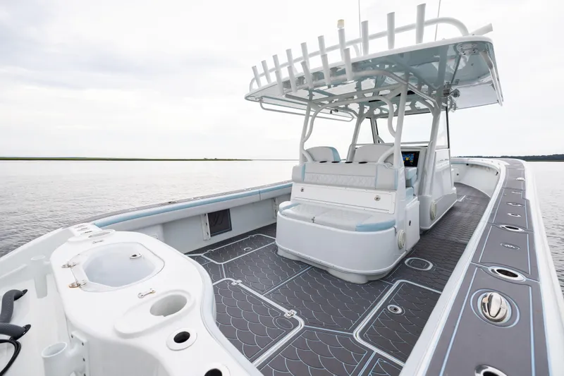 Slide: The Image of 2018 Yellowfin 39 Offshore boat with spacious deck and modern seating on calm water. - 68