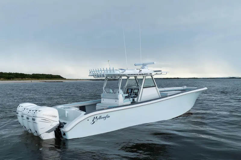 Slide: The Image of 2018 Yellowfin 39 Offshore boat with triple Mercury engines on open water. - 7