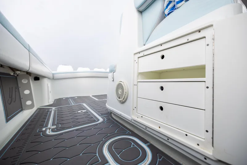 Slide: The Image of 2018 Yellowfin 39 Offshore boat interior with storage drawers and patterned flooring. - 73