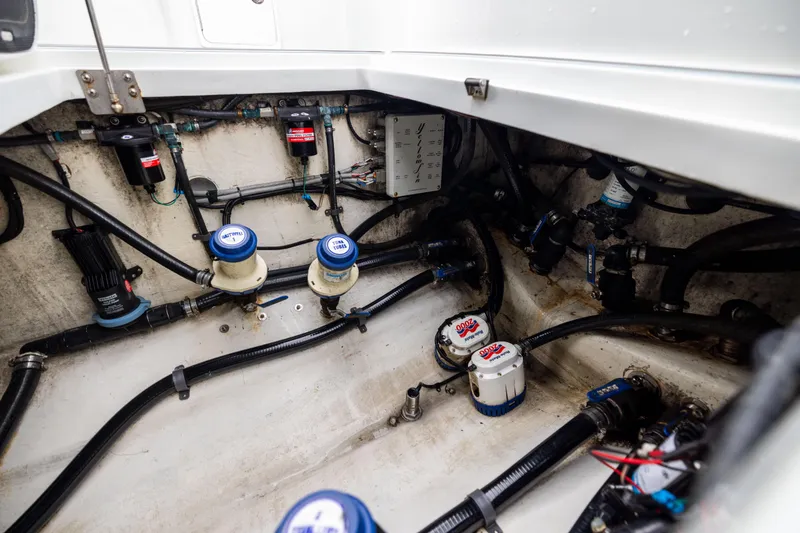 Slide: The Image of Engine compartment of a 2018 Yellowfin 39 Offshore boat, showcasing mechanical components. - 75