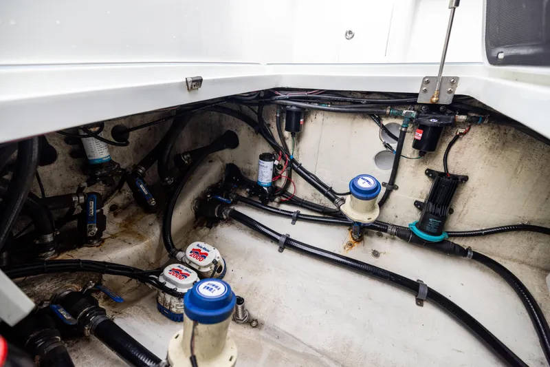 Slide: The Image of Engine compartment of 2018 Yellowfin 39 Offshore boat, showcasing wiring and components. - 76