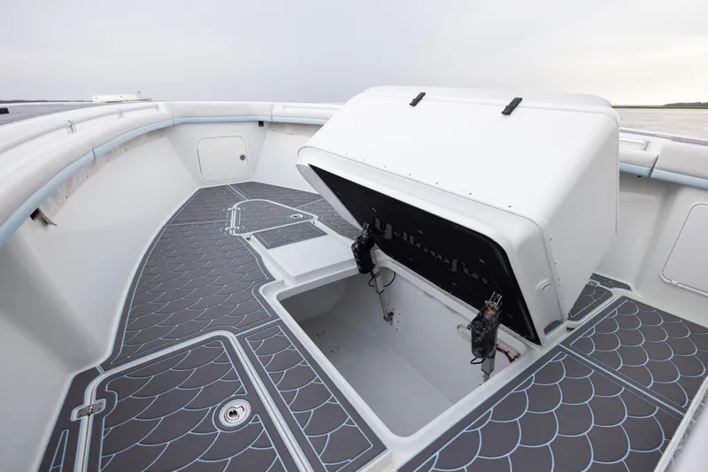 Slide: The Image of 2018 Yellowfin 39 Offshore boat deck with open storage compartment. - 82