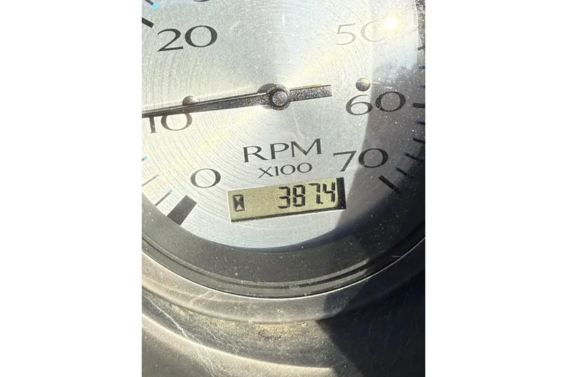 Slide: The Image of Close-up of 2019 Bennington G 22 GSRFB RPM gauge showing 3874 hours. - 12