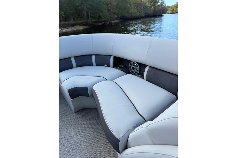 Slide: The Image of 2019 Bennington G 22 GSRFB boat interior with plush seating by the water. - 13