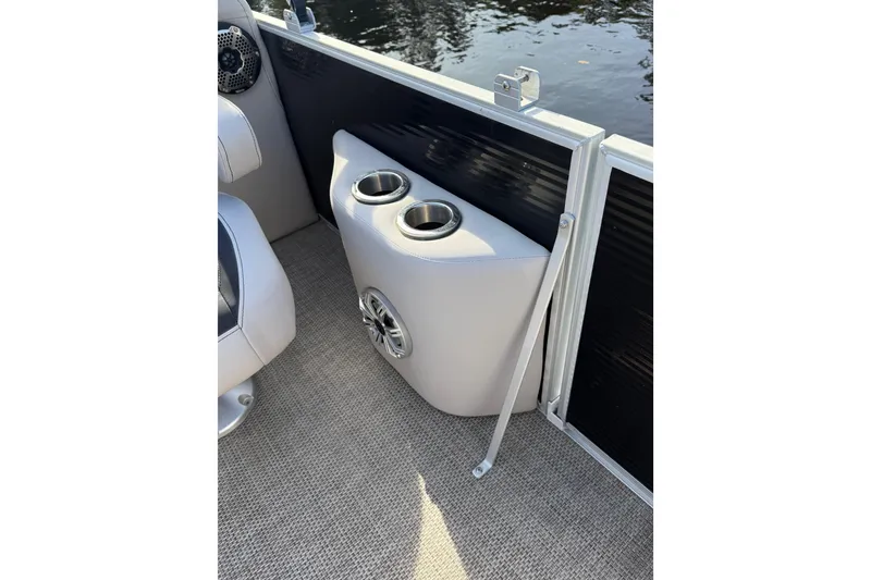 Slide: The Image of 2019 Bennington G 22 GSRFB boat interior with cup holders and speaker. - 17