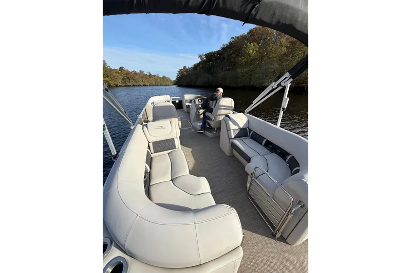 Slide: The Image of 2019 Bennington G 22 GSRFB pontoon boat with luxurious seating on a serene river. - 6
