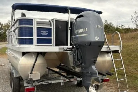 Slide: The Image of 2022 Bennington 22SXSAPG pontoon boat with Yamaha 150 engine on trailer. - 3