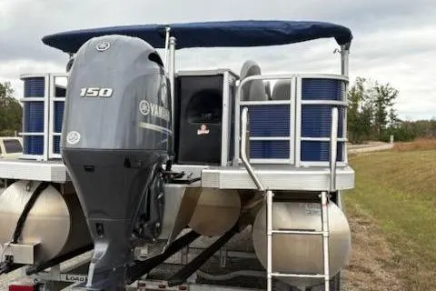 Slide: The Image of 2022 Bennington 22SXSAPG pontoon boat with Yamaha 150 engine on trailer. - 4
