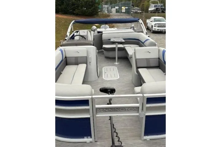 Slide: The Image of 2022 Bennington 22SXSAPG pontoon boat with spacious seating and modern design. - 6