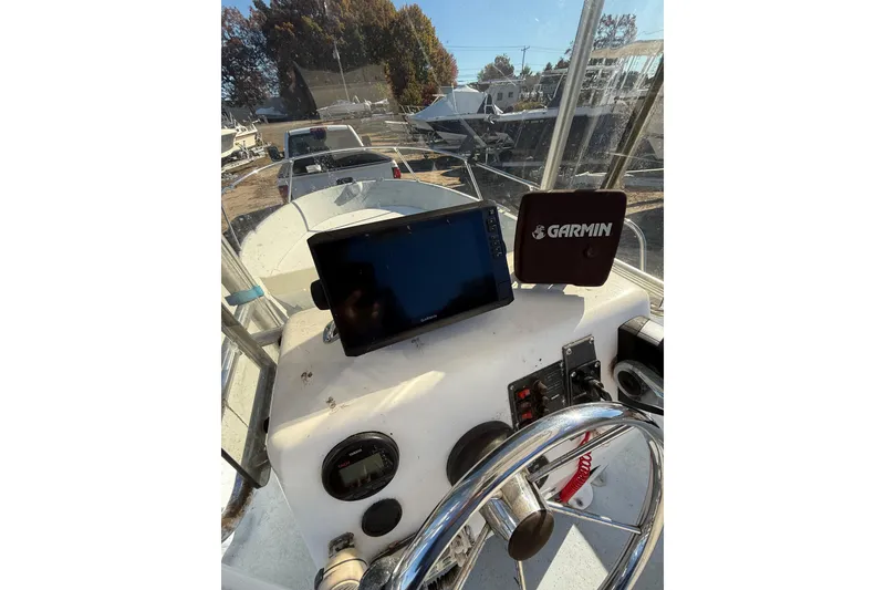 Slide: The Image of 2001 Maritime Skiff 18 boat dashboard with Garmin navigation system. - 8