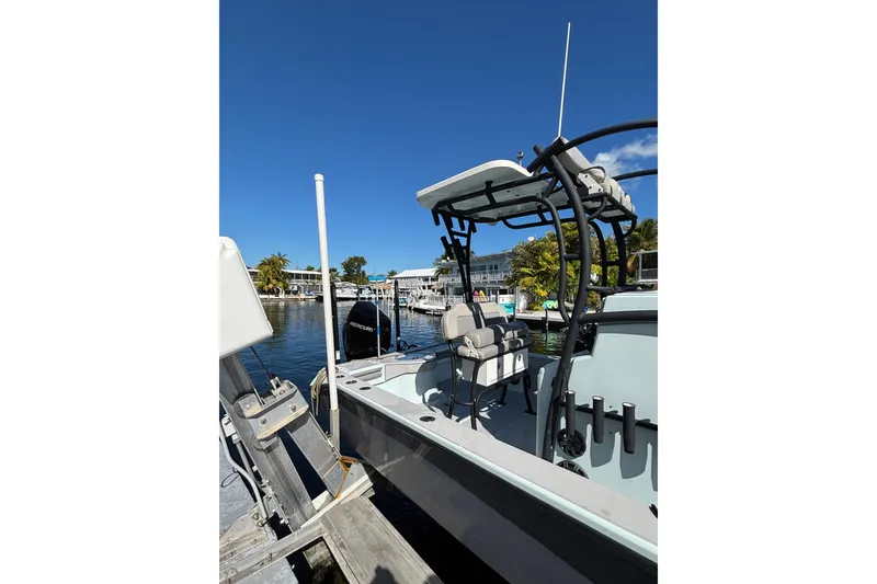 Slide: The Image of 2021 Xplor 24 Andros boat docked under clear blue sky. - 16