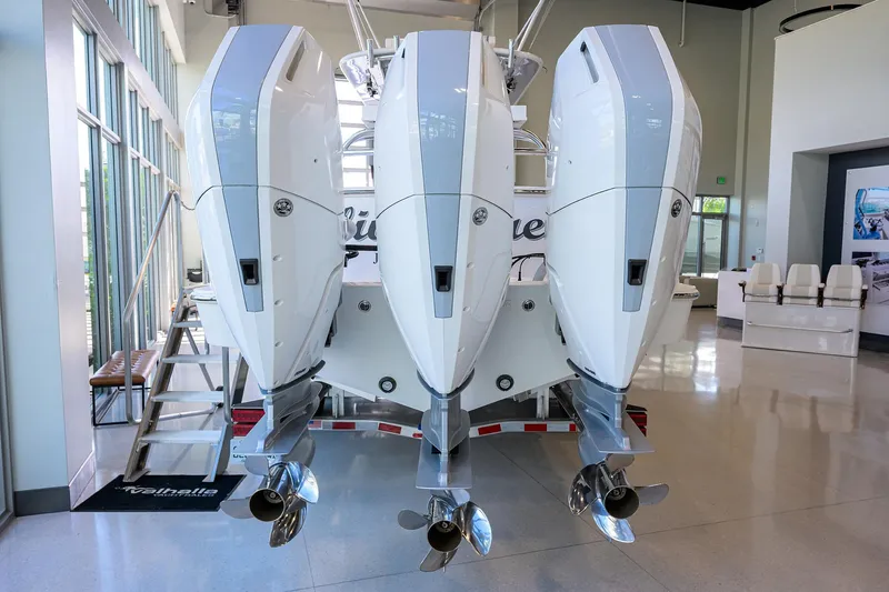 Slide: The Image of 2025 Valhalla V-37 boat with triple outboard engines in showroom. - 38
