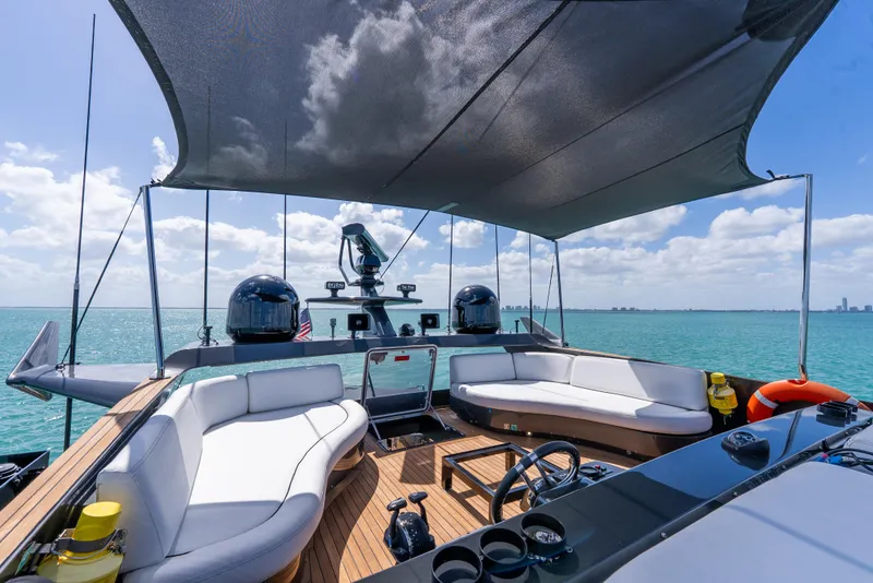 Slide: The Image of Luxurious Palmer Johnson 120 yacht deck with seating, ocean view, and sunshade, 2003 model. - 11