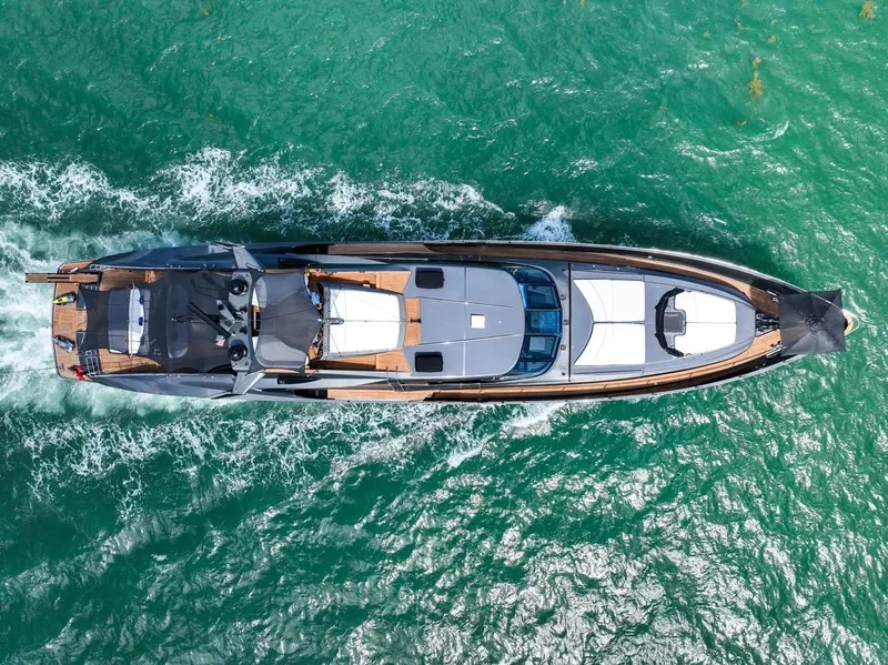 Slide: The Image of Aerial view of 2003 Palmer Johnson 120 yacht cruising on turquoise waters. - 13