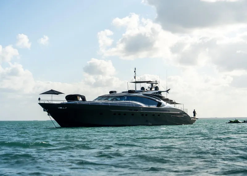 Slide: The Image of Luxury Palmer Johnson 120 yacht from 2003 on calm sea under cloudy sky. - 14