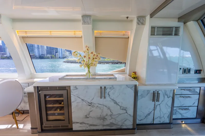 Slide: The Image of Luxurious interior of 2003 Palmer Johnson 120 yacht with marble countertops and waterfront view. - 17