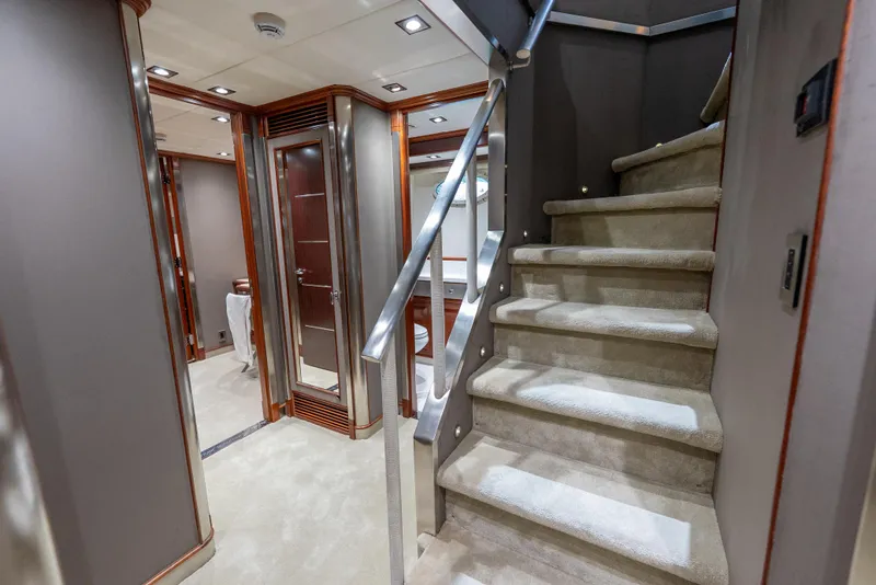 Slide: The Image of Luxurious interior of 2003 Palmer Johnson 120 yacht with carpeted stairs and elegant wood finishes. - 19
