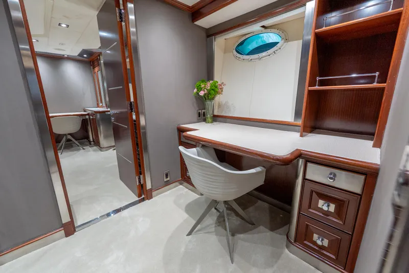 Slide: The Image of Luxurious interior of 2003 Palmer Johnson 120 yacht with elegant desk and chair setup. - 21