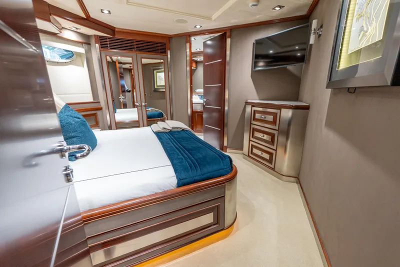 Slide: The Image of Luxurious bedroom interior of 2003 Palmer Johnson 120 yacht with modern furnishings and elegant decor. - 30