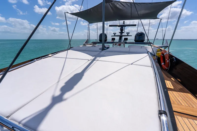 Slide: The Image of Luxury Palmer Johnson 120 yacht deck with sunshade, 2003 model, on serene ocean waters. - 37