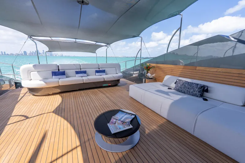 Slide: The Image of Luxurious Palmer Johnson 120 yacht deck with elegant seating, ocean view, and modern design, 2003 model. - 4