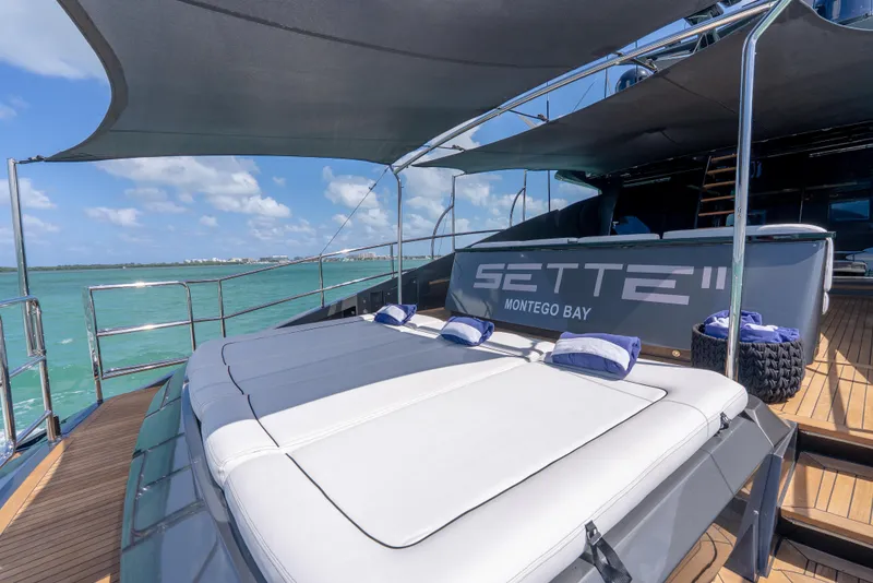 Slide: The Image of Luxury Palmer Johnson 120 yacht deck with sunbeds, ocean view, and shade canopy, 2003 model. - 43
