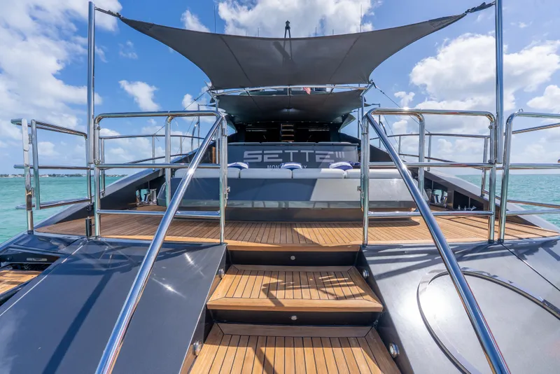 Slide: The Image of Luxurious Palmer Johnson 120 yacht deck with sleek design, 2003 model, under a sunny sky. - 46