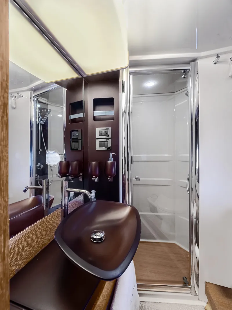 Slide: The Image of Luxurious bathroom in 2013 Azimut 64 yacht with modern fixtures and sleek design. - 12