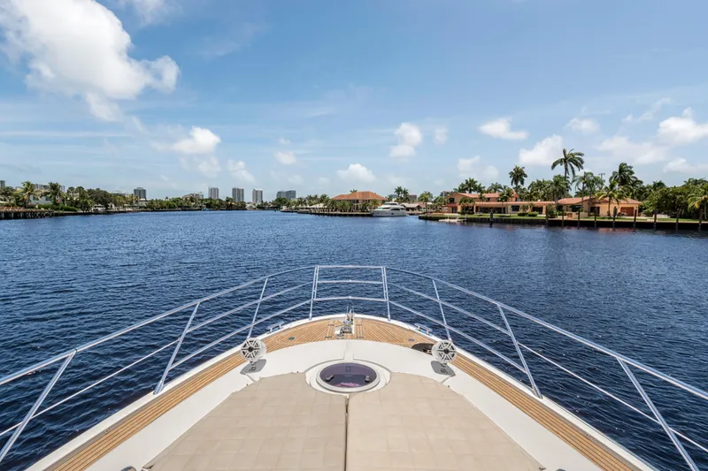 Slide: The Image of Bow view of 2013 Azimut 64 yacht cruising on a sunny day. - 15