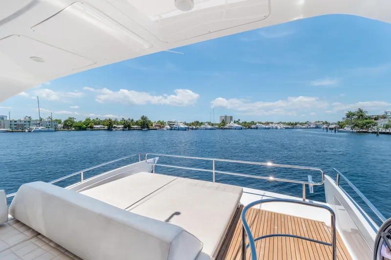 Slide: The Image of Luxurious 2013 Azimut 64 yacht deck with scenic waterfront view. - 3