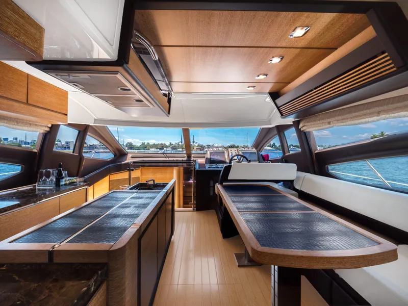 Slide: The Image of Luxurious interior of 2013 Azimut 64 yacht with modern kitchen and dining area. - 4