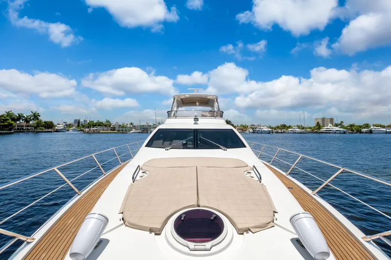 Slide: The Image of Luxurious 2013 Azimut 64 yacht on serene water under a bright blue sky. - 5