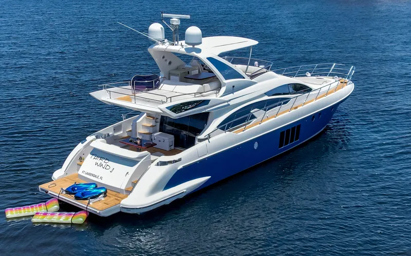 Slide: The Image of Luxurious 2013 Azimut 64 yacht on open water, featuring sleek design and spacious deck. - 6