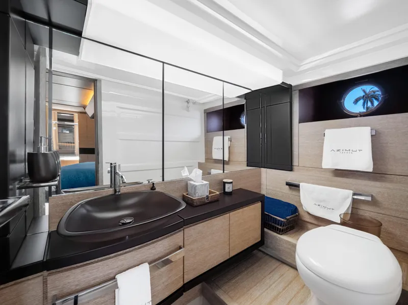 Slide: The Image of Luxurious bathroom in 2013 Azimut 64 yacht with modern fixtures and elegant design. - 8