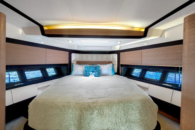 Slide: The Image of Luxurious bedroom interior of 2013 Azimut 64 yacht with elegant bedding and panoramic windows. - 9
