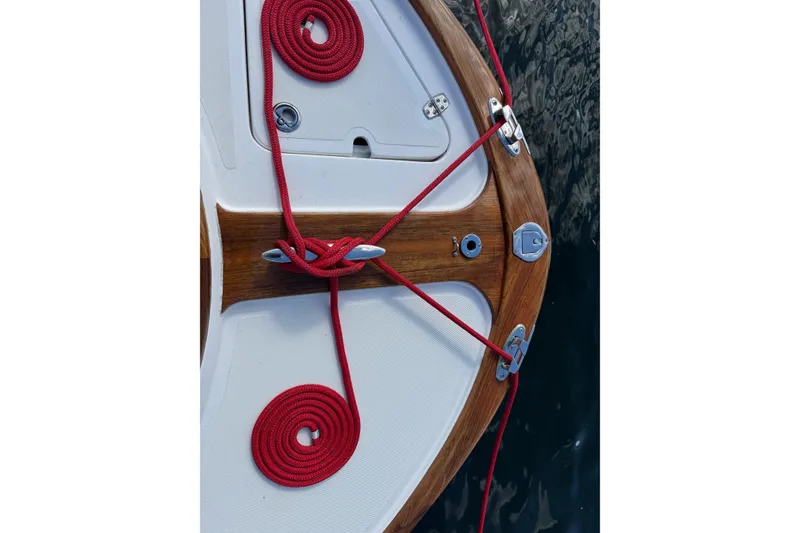 Slide: The Image of Bow of 2011 Hunt Yachts Surfhunter 25 with red ropes and wooden accents. - 10