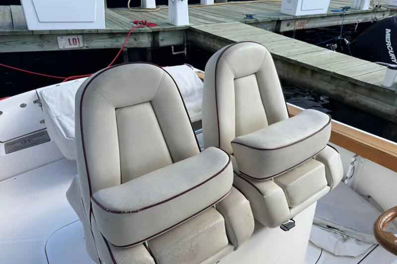 Slide: The Image of 2011 Hunt Yachts Surfhunter 25 Center Console with dual cushioned seats at dock. - 5