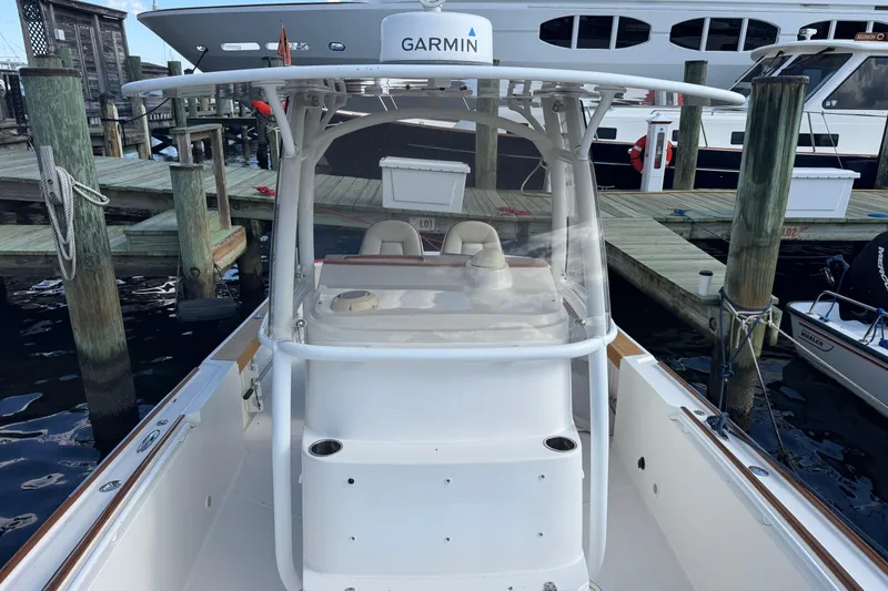 Slide: The Image of 2011 Hunt Yachts Surfhunter 25 Center Console docked, featuring Garmin equipment. - 8