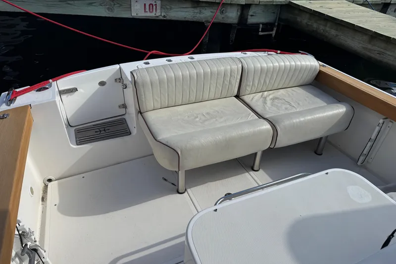 Slide: The Image of 2011 Hunt Yachts Surfhunter 25 Center Console with white seating and deck. - 6